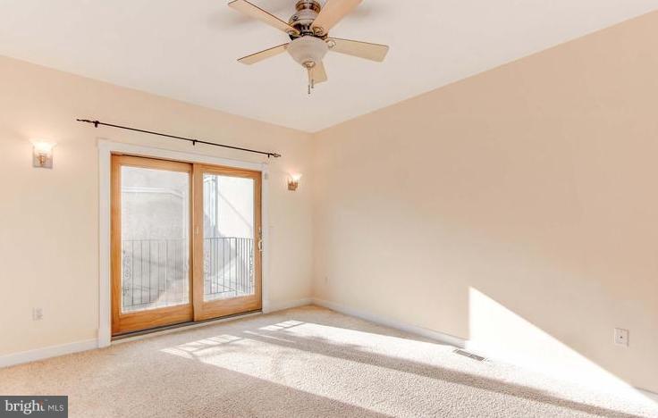 3403 Dillon Street Baltimore, MD 21224 - Photo 22 of 30 a view of an empty room with a window