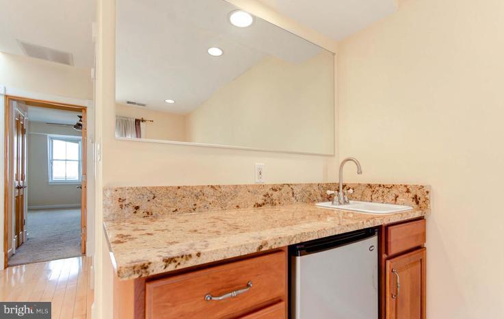 3403 Dillon Street Baltimore, MD 21224 - Photo 24 of 30 a bathroom with a sink and a mirror