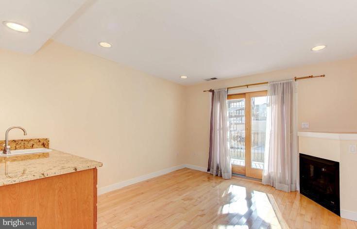 3403 Dillon Street Baltimore, MD 21224 - Photo 25 of 30 a view of a livingroom with a fireplace
