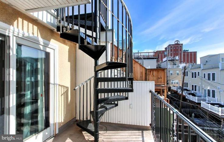 3403 Dillon Street Baltimore, MD 21224 - Photo 30 of 30 a view of buildings from the balcony