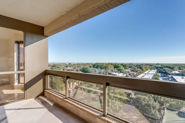 a view of a swimming pool with a yard