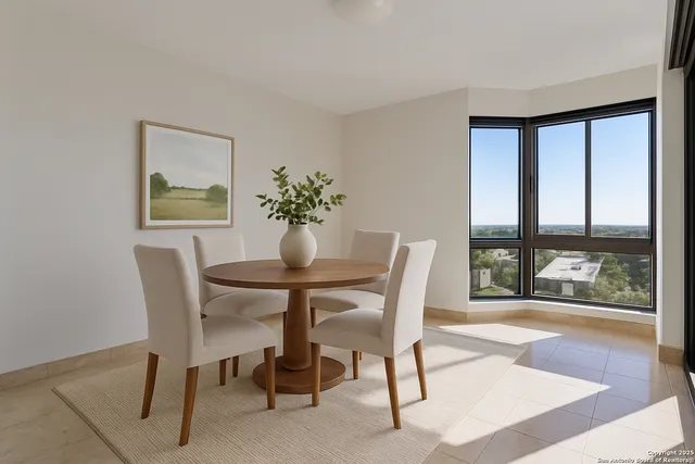 a dining room with furniture and wooden floor
