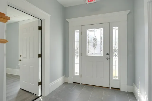 a view of an entryway with wooden floor