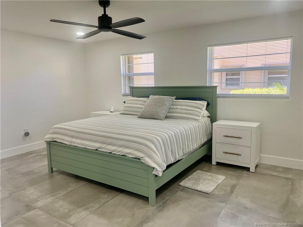 2600 South Kanner Highway, Unit D6 Stuart, FL 34994 - Photo 12 of 25 a bedroom with a bed and a ceiling fan