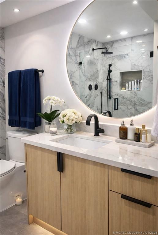 2600 South Kanner Highway, Unit D6 Stuart, FL 34994 - Photo 15 of 25 a kitchen with stainless steel appliances granite countertop a sink and a white cabinets