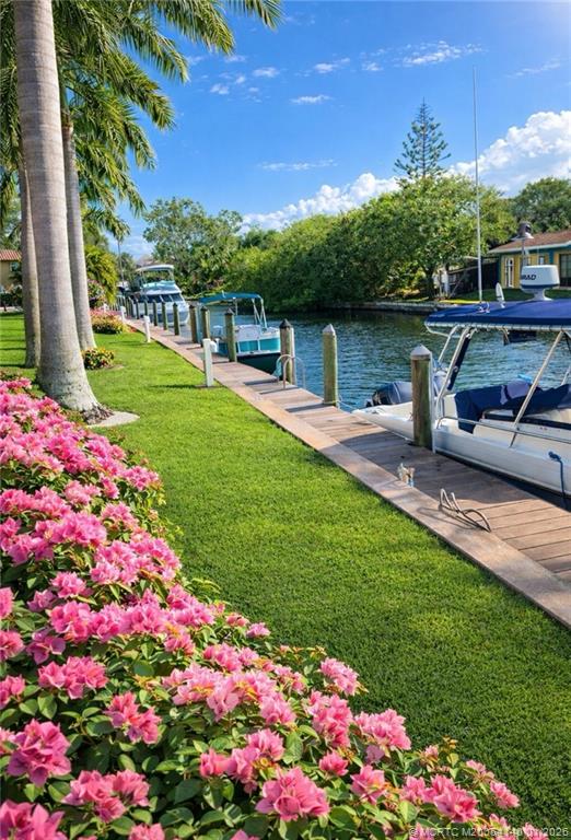 2600 South Kanner Highway, Unit D6 Stuart, FL 34994 - Photo 24 of 25 a front view of a house with a yard and fountain