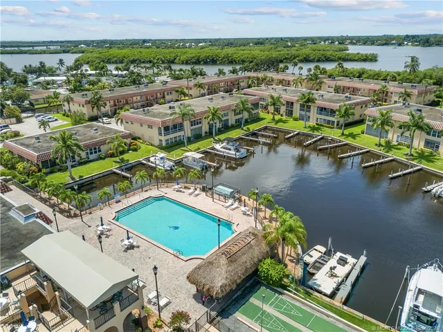 an aerial view of a house with a ocean view