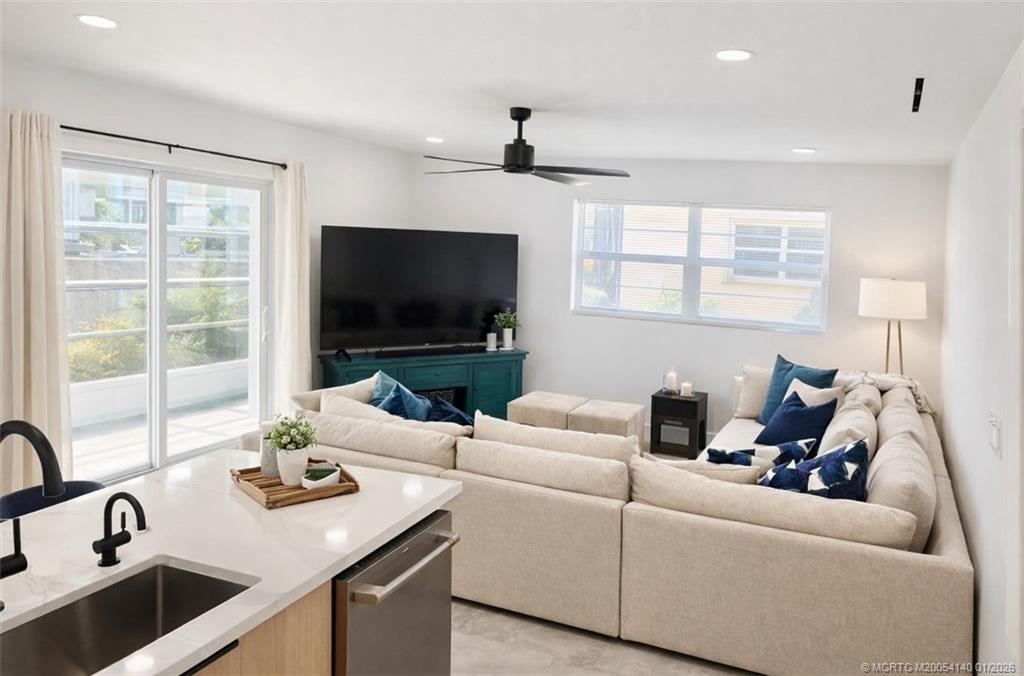 2600 South Kanner Highway, Unit D6 Stuart, FL 34994 - Photo 7 of 25 a living room with furniture and a flat screen tv