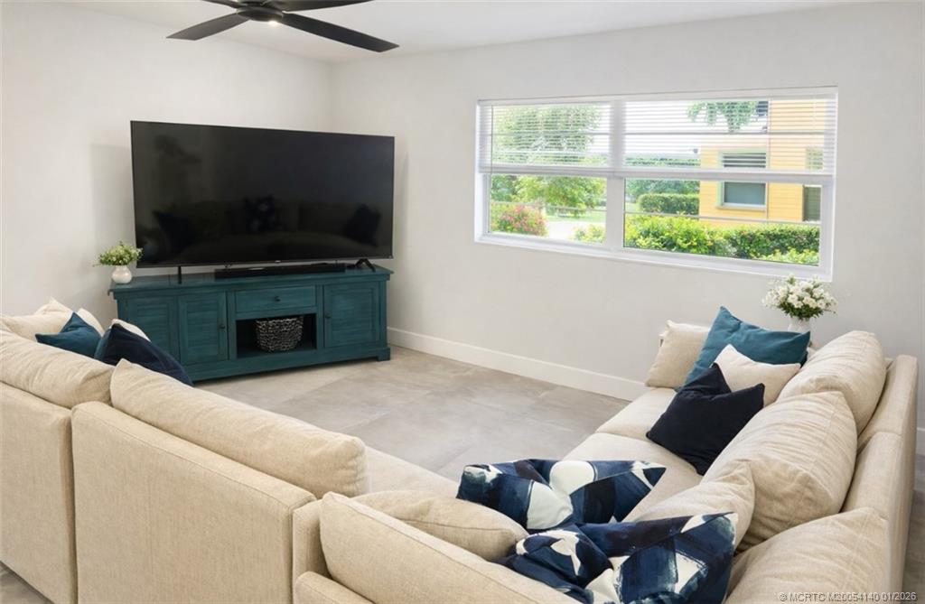 2600 South Kanner Highway, Unit D6 Stuart, FL 34994 - Photo 8 of 25 a living room with furniture and a flat screen tv