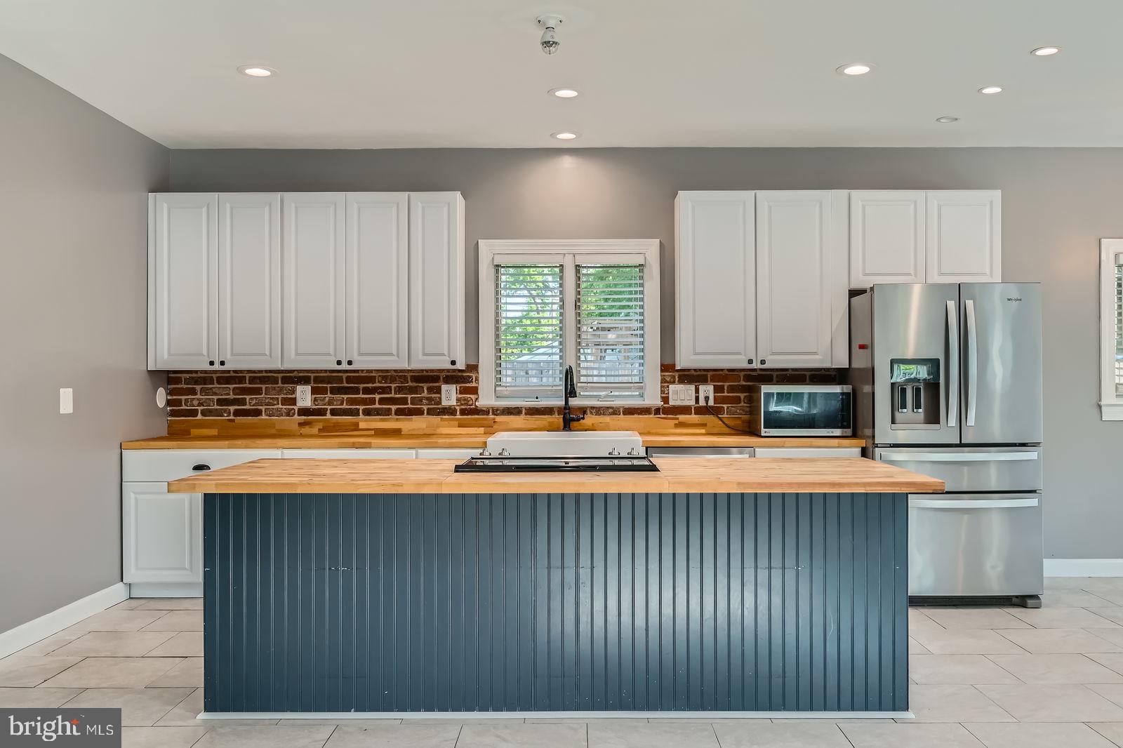 302 Haskell Drive Arnold, MD 21012 - Photo 1 of 31 a kitchen with stainless steel appliances granite countertop a stove a sink and a refrigerator