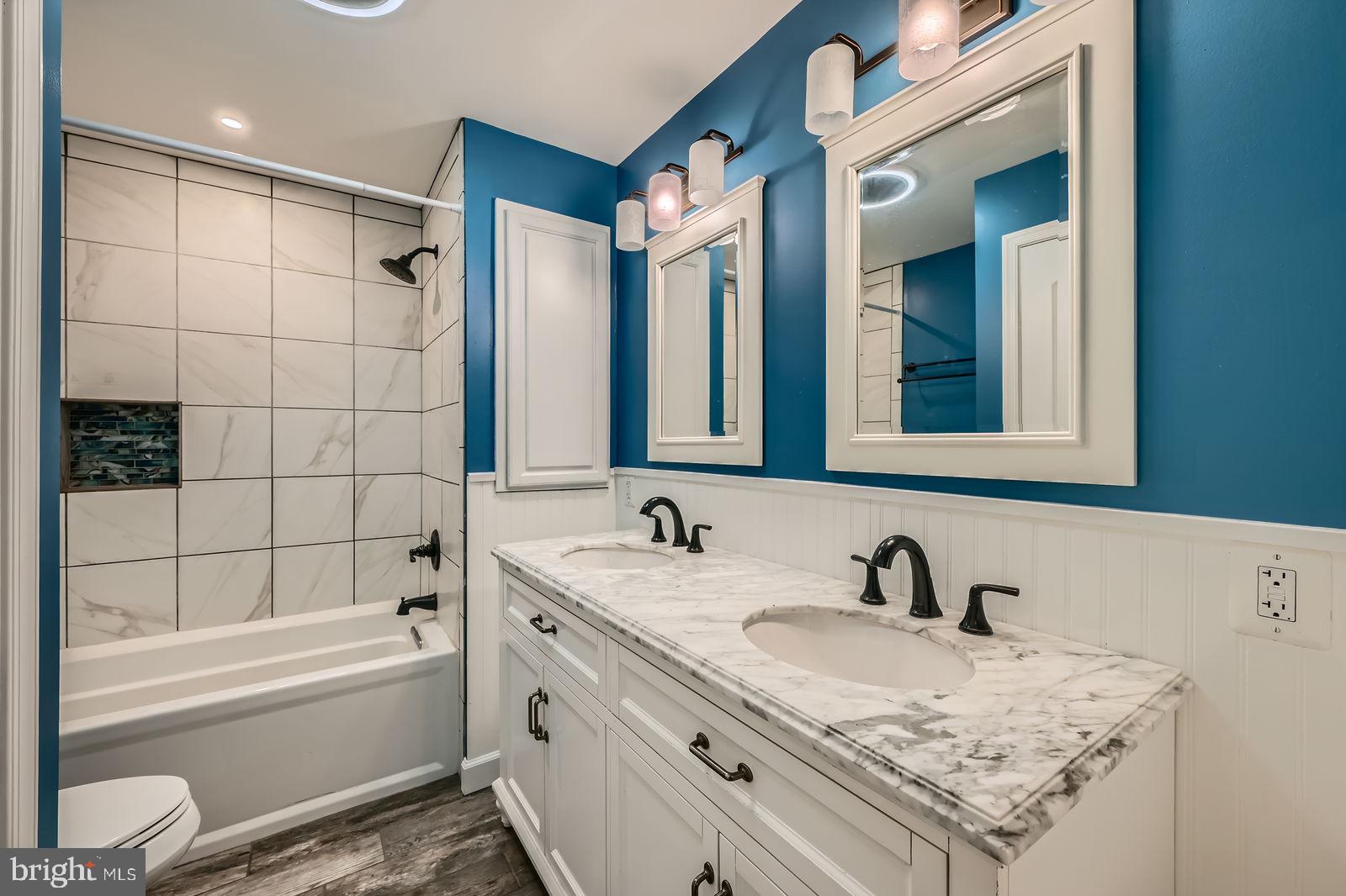 302 Haskell Drive Arnold, MD 21012 - Photo 14 of 31 a bathroom with a granite countertop sink and a bathtub