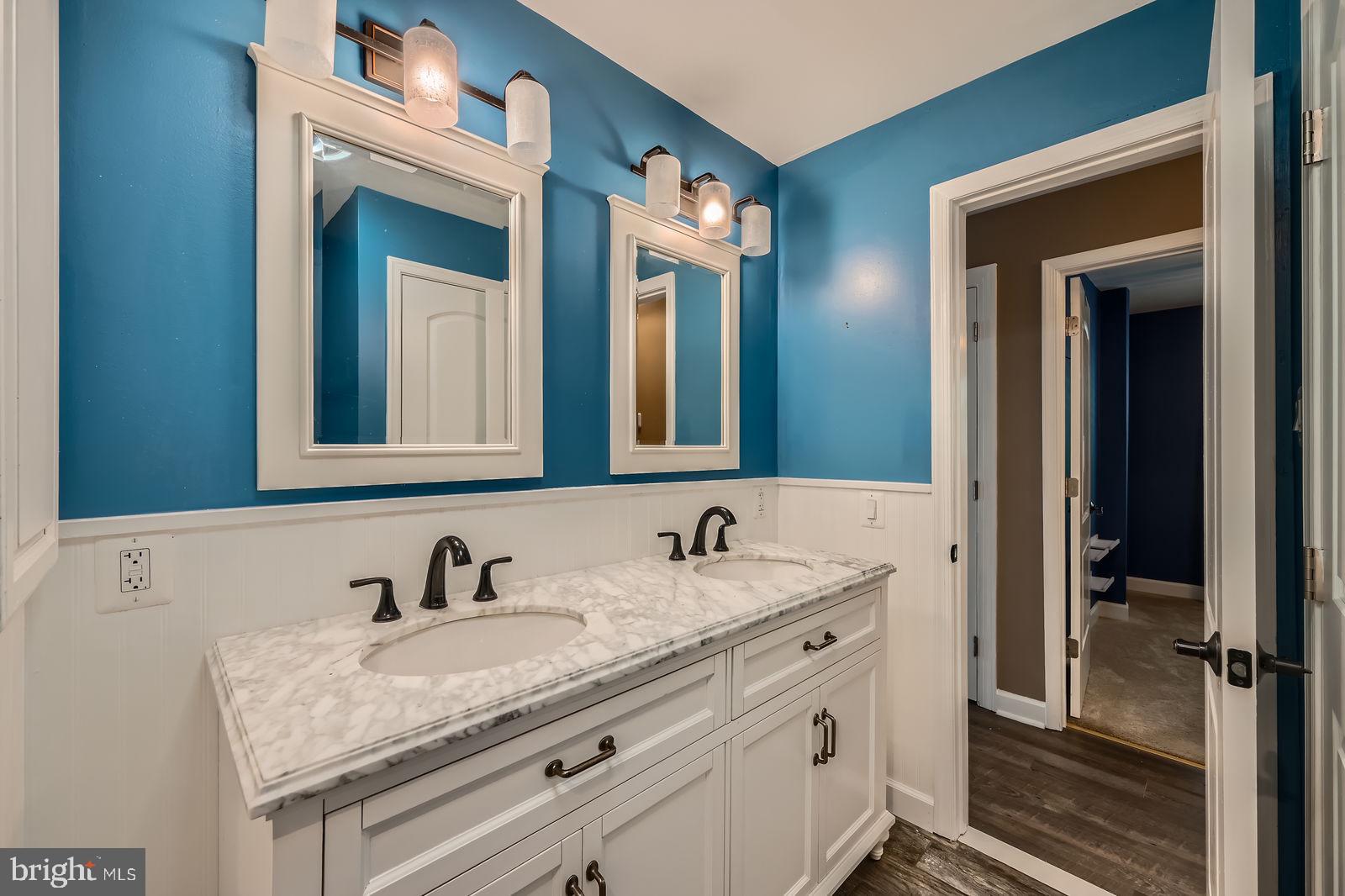 302 Haskell Drive Arnold, MD 21012 - Photo 15 of 31 a bathroom with a granite countertop sink and a mirror