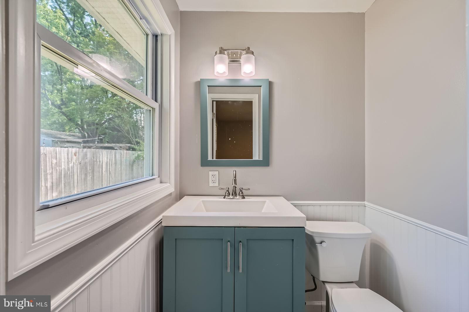 302 Haskell Drive Arnold, MD 21012 - Photo 17 of 31 a bathroom with a toilet sink and mirror
