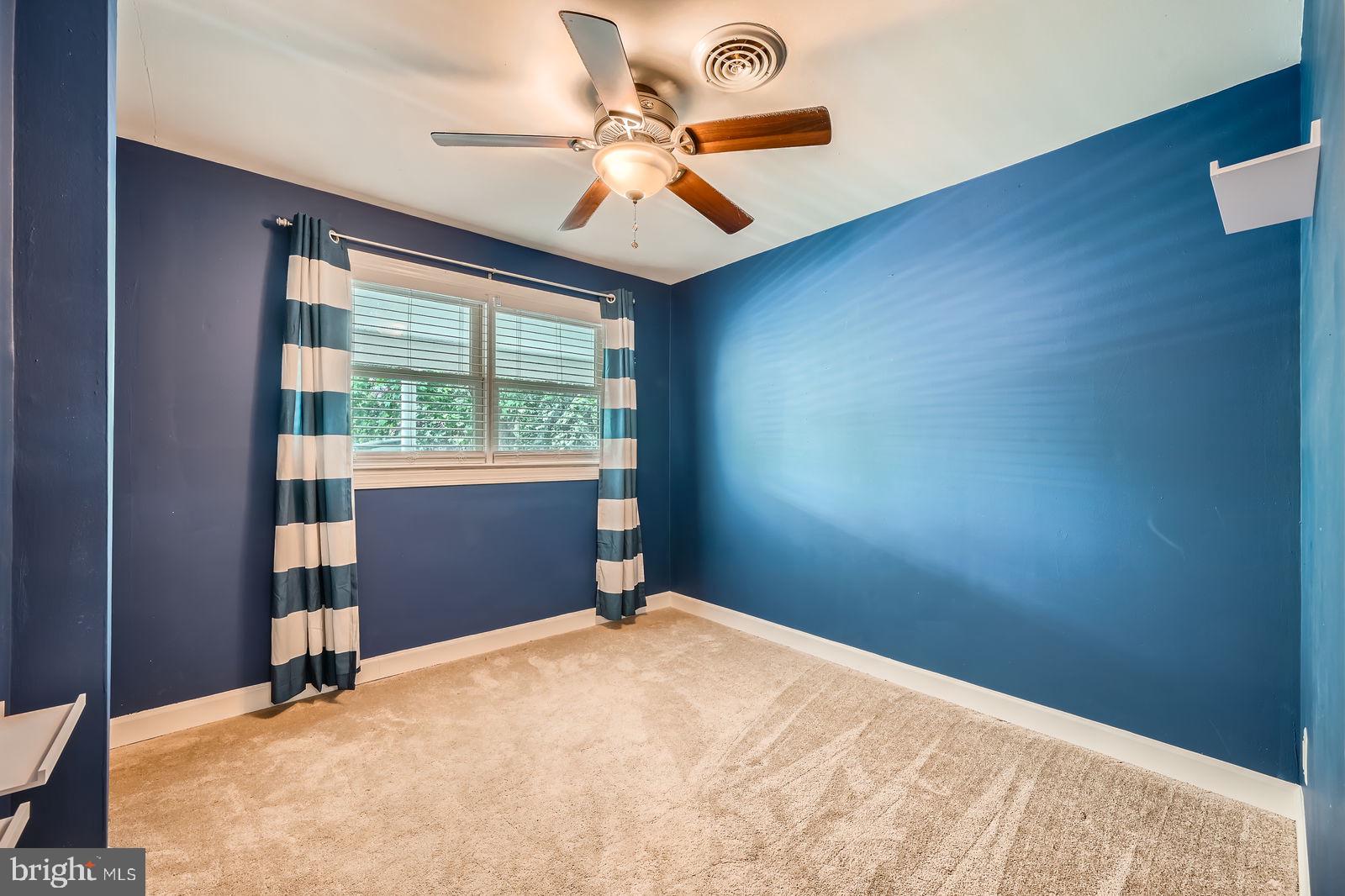 302 Haskell Drive Arnold, MD 21012 - Photo 18 of 31 a bedroom with a bed and a large window