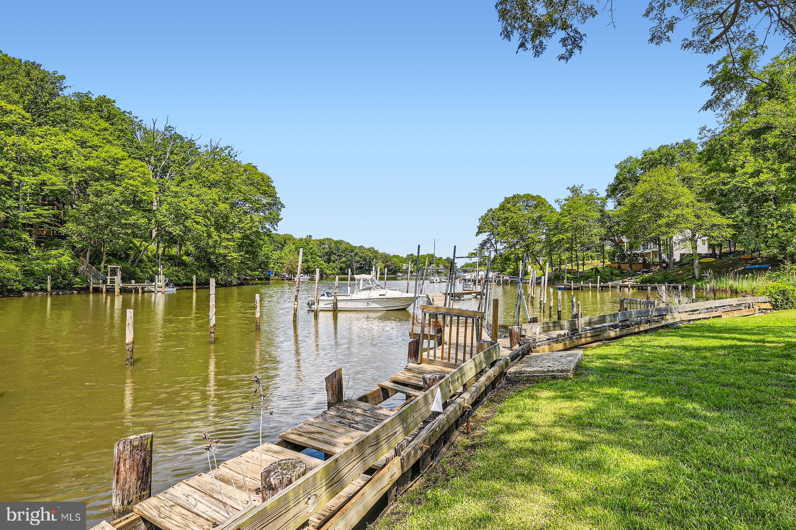 302 Haskell Drive Arnold, MD 21012 - Photo 20 of 31 a view of a lake with houses in the background