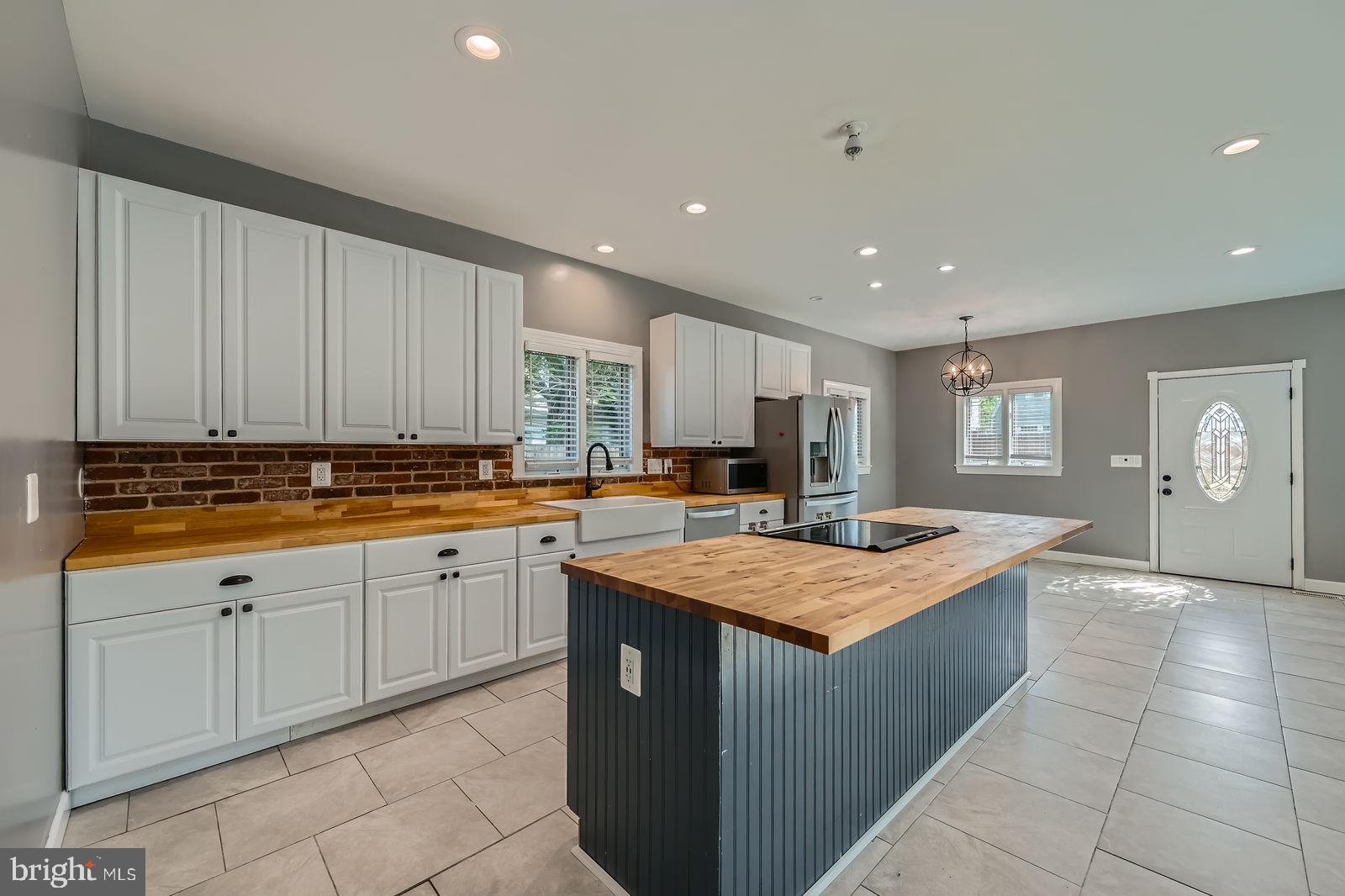 302 Haskell Drive Arnold, MD 21012 - Photo 26 of 31 a kitchen with a stove sink and cabinets