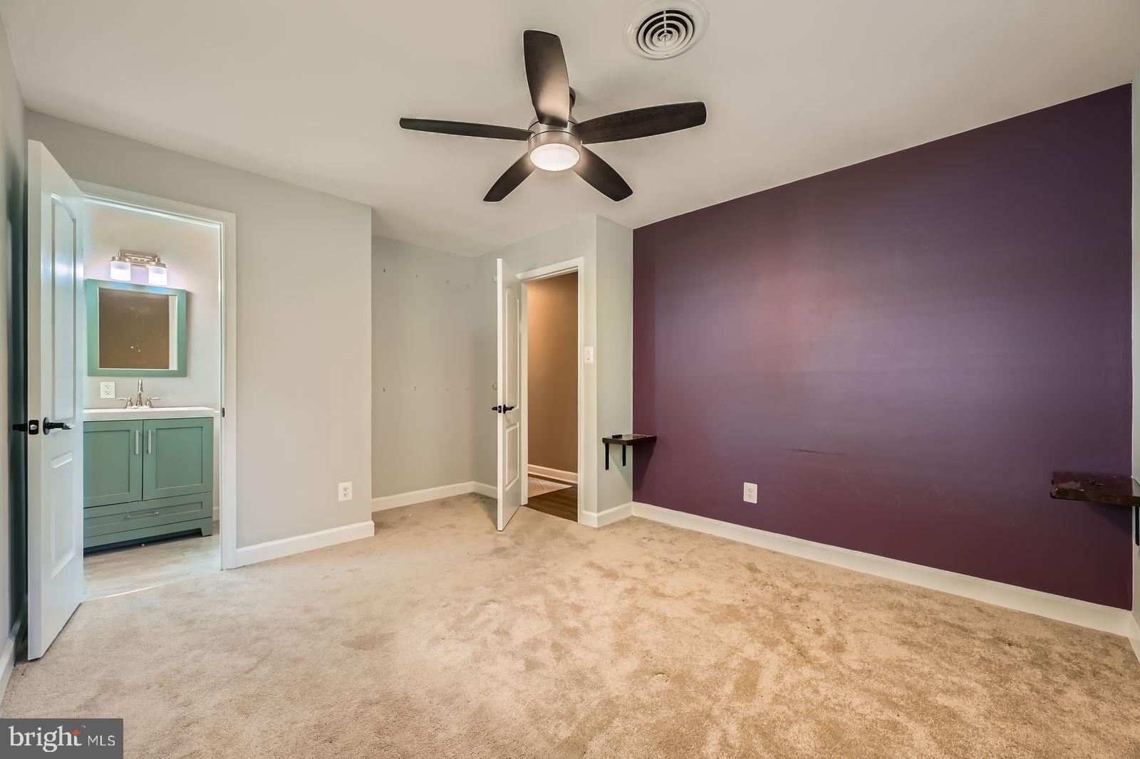 302 Haskell Drive Arnold, MD 21012 - Photo 28 of 31 an empty room with a ceiling fan and window