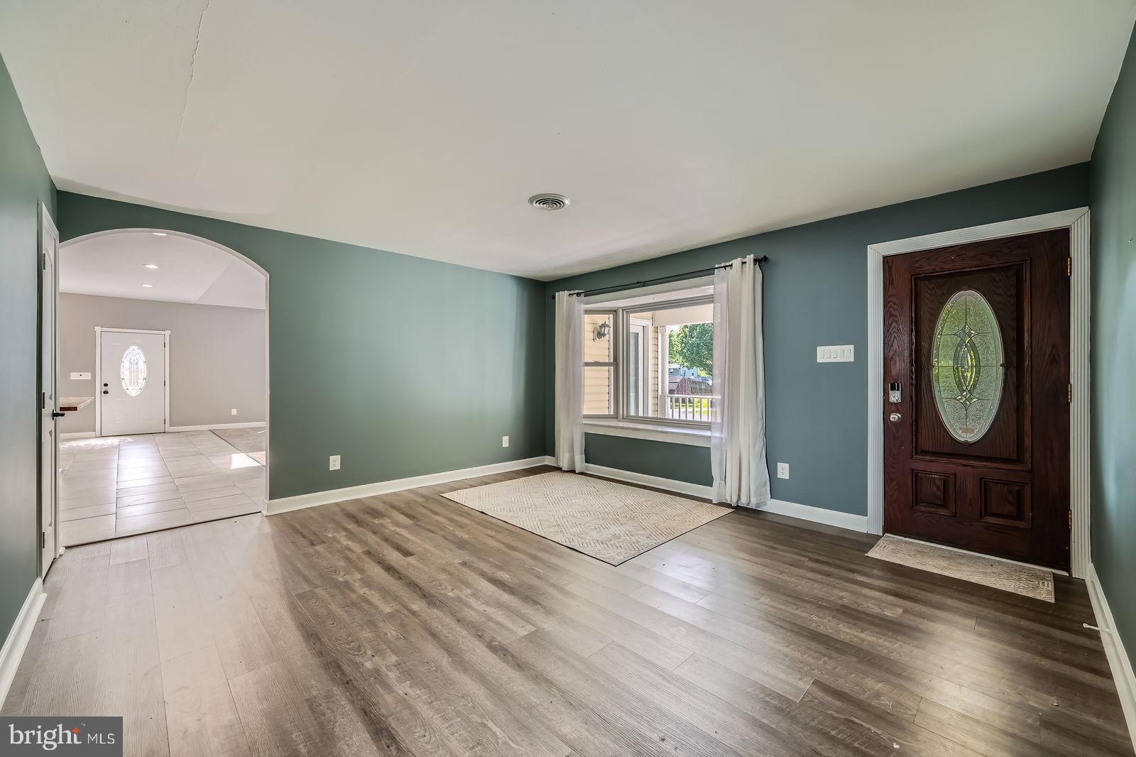 302 Haskell Drive Arnold, MD 21012 - Photo 10 of 31 a view of an empty room and window with wooden floor