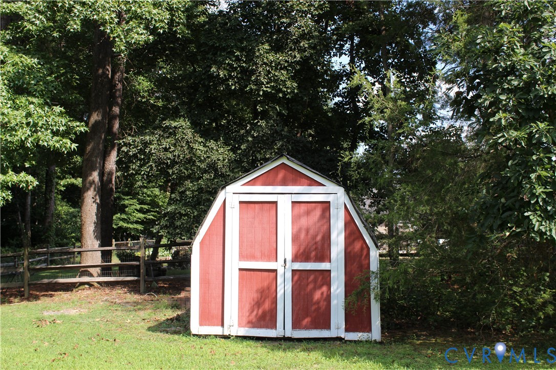 16524 Benmore Road Moseley, VA 23120 - Photo 12 of 43 a view of backyard with deck and garden