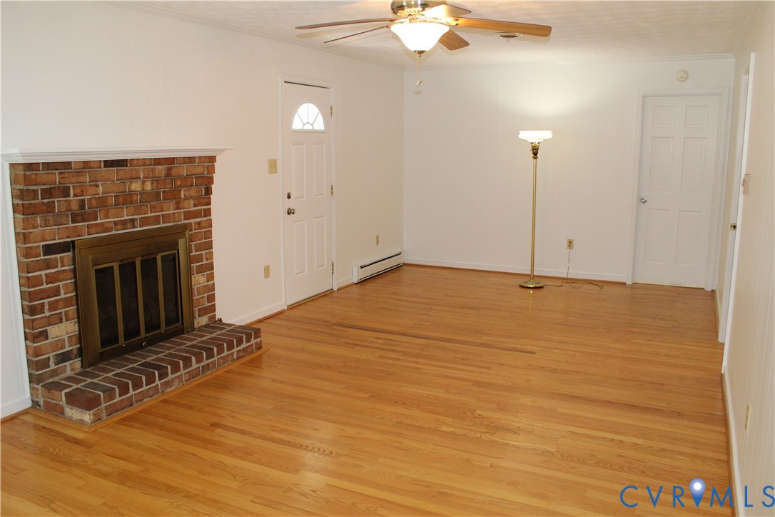 16524 Benmore Road Moseley, VA 23120 - Photo 14 of 43 a view of empty room with wooden floor and fan