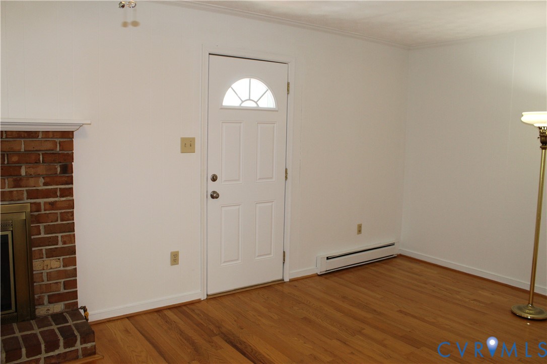 16524 Benmore Road Moseley, VA 23120 - Photo 15 of 43 a view of empty room with wooden floor and window