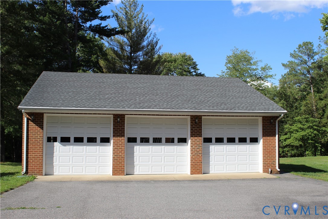 16524 Benmore Road Moseley, VA 23120 - Photo 2 of 43 front view of a house with a yard