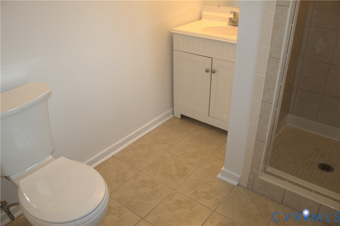 16524 Benmore Road Moseley, VA 23120 - Photo 30 of 43 a bathroom with a toilet and a sink