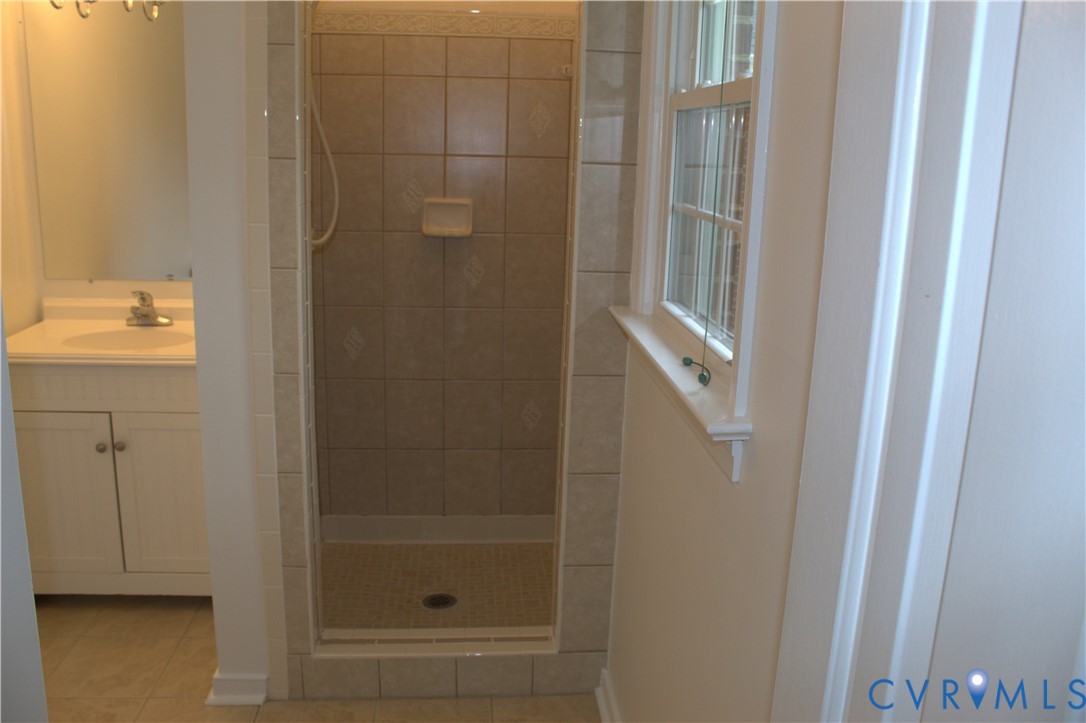 16524 Benmore Road Moseley, VA 23120 - Photo 31 of 43 a bathroom with a glass shower door