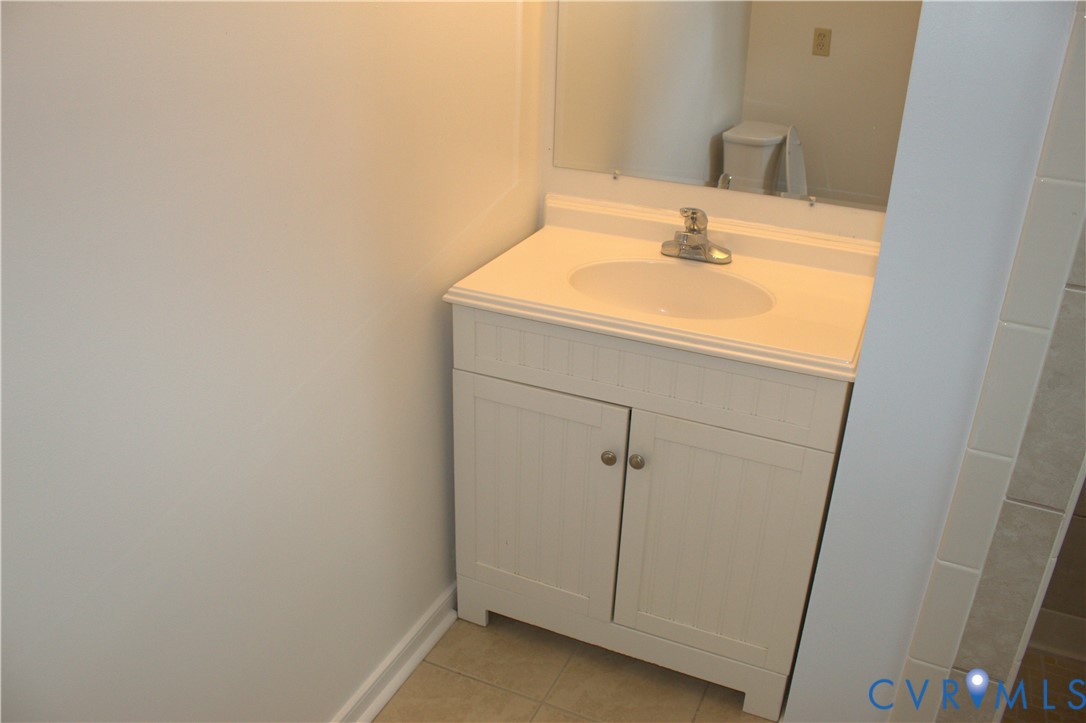 16524 Benmore Road Moseley, VA 23120 - Photo 32 of 43 a bathroom with a sink and vanity