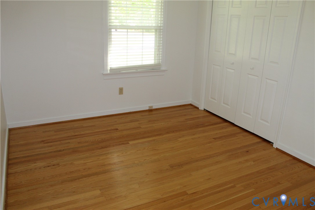 16524 Benmore Road Moseley, VA 23120 - Photo 35 of 43 an empty room with wooden floor and windows