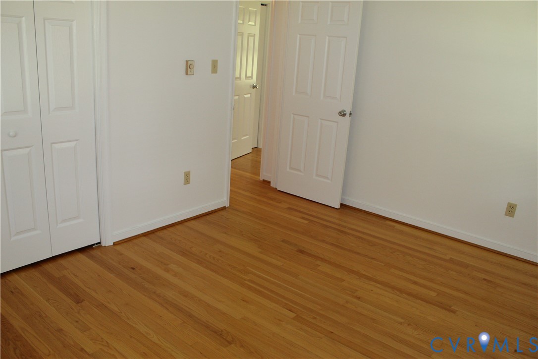 16524 Benmore Road Moseley, VA 23120 - Photo 36 of 43 a view of an empty room with wooden floor