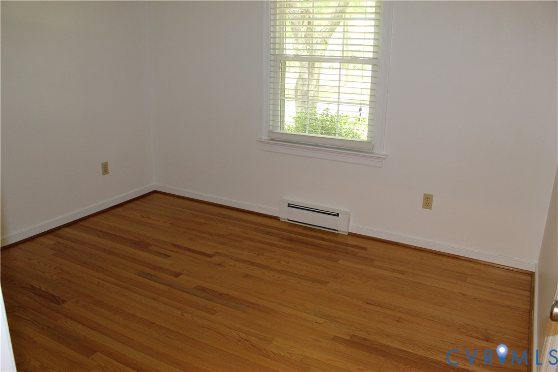 16524 Benmore Road Moseley, VA 23120 - Photo 37 of 43 an empty room with wooden floor and windows