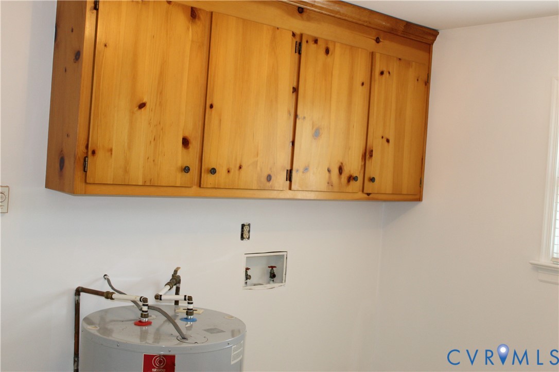 16524 Benmore Road Moseley, VA 23120 - Photo 40 of 43 a bathroom with a sink and cabinets