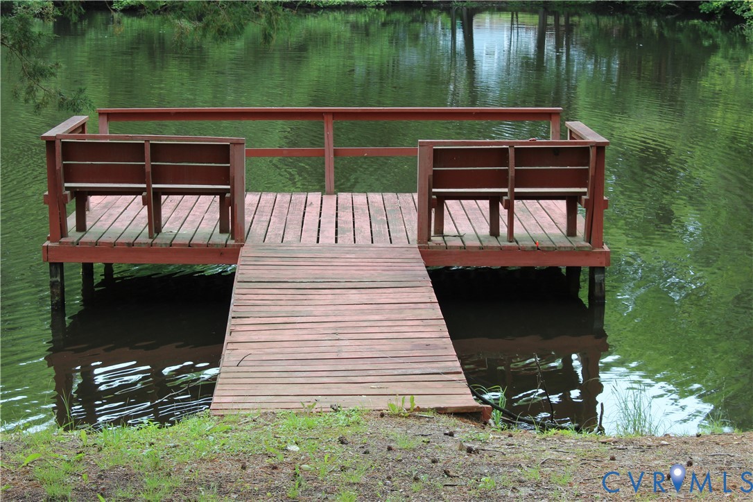 16524 Benmore Road Moseley, VA 23120 - Photo 5 of 43 a backyard of a house with table and chairs