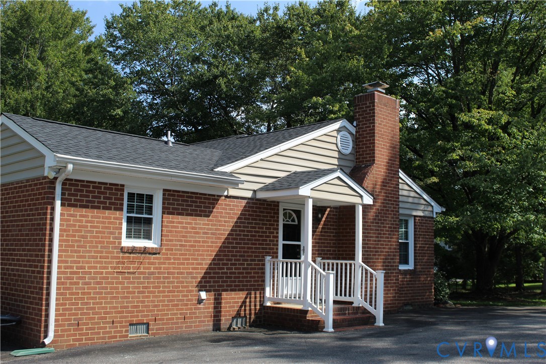 16524 Benmore Road Moseley, VA 23120 - Photo 7 of 43 a front view of a house with a yard