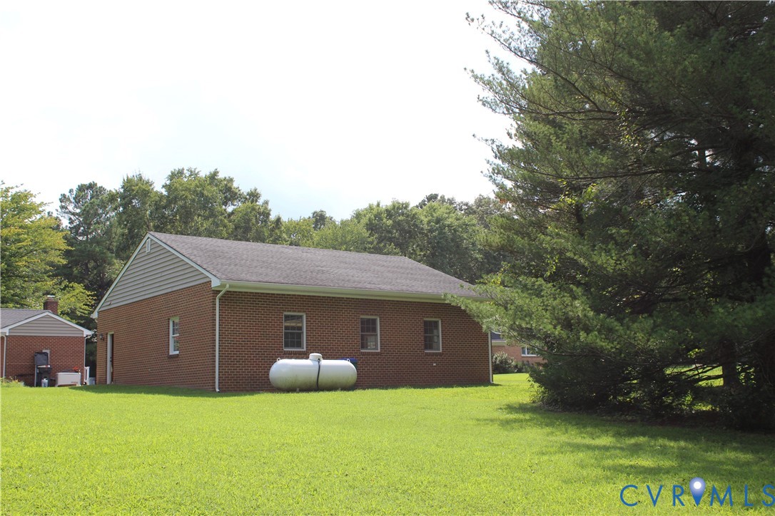 16524 Benmore Road Moseley, VA 23120 - Photo 9 of 43 a aerial view of a house with yard and roof