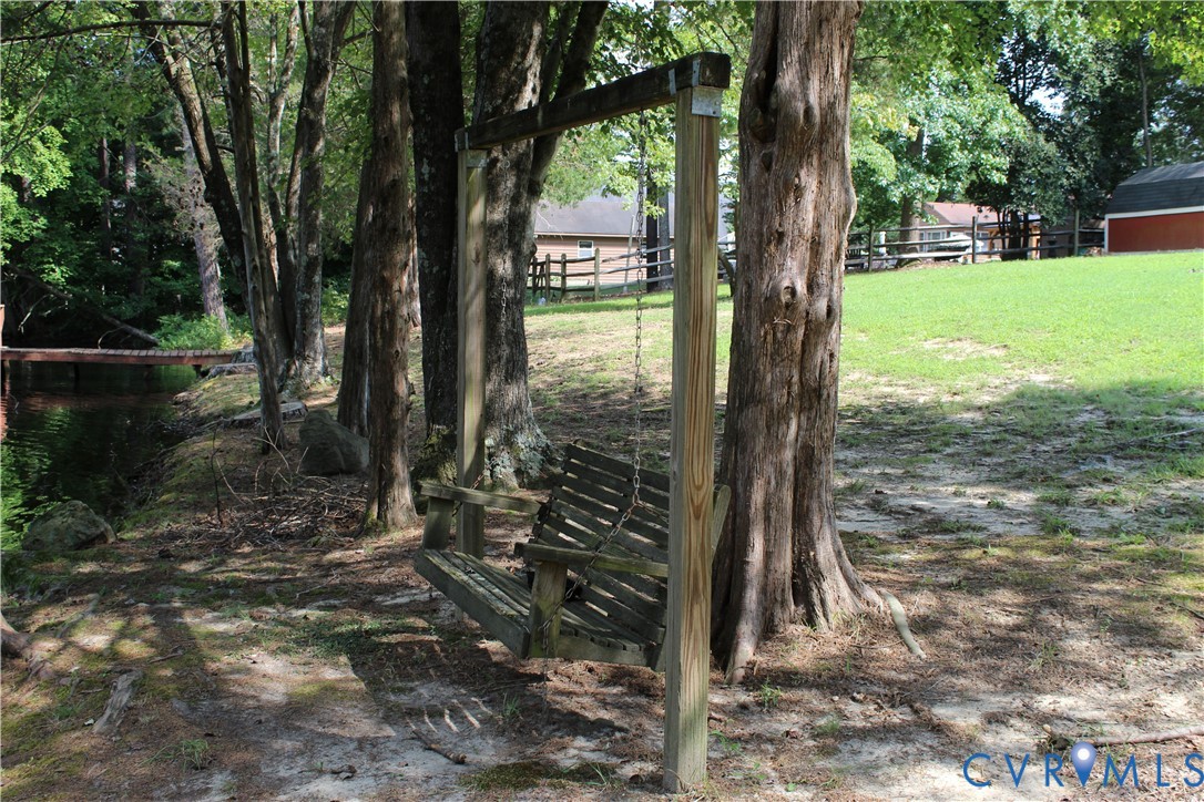 16524 Benmore Road Moseley, VA 23120 - Photo 10 of 43 a view of a yard in front of a house with a large tree