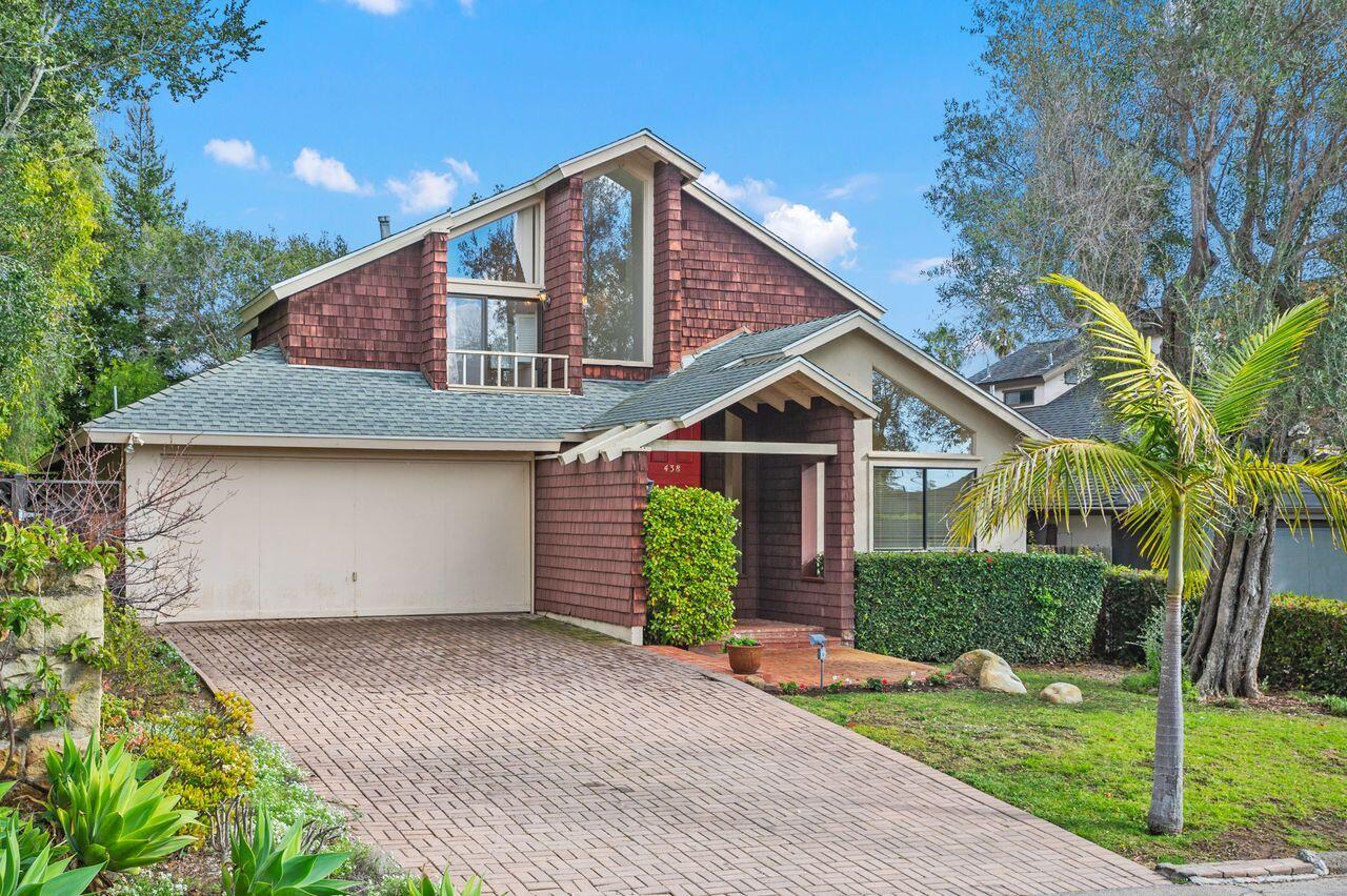 438 Seaview Road Montecito, CA 93108 - Photo 2 of 5 a front view of a house with a yard and garage