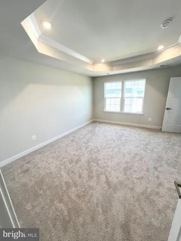 a bathroom with a toilet a sink and a mirror