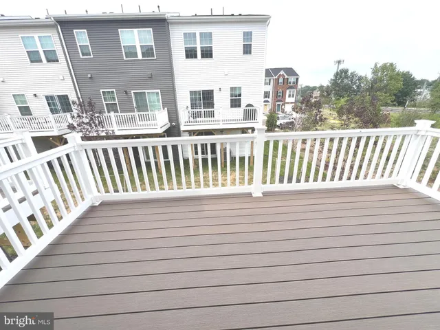 a balcony with wooden floor