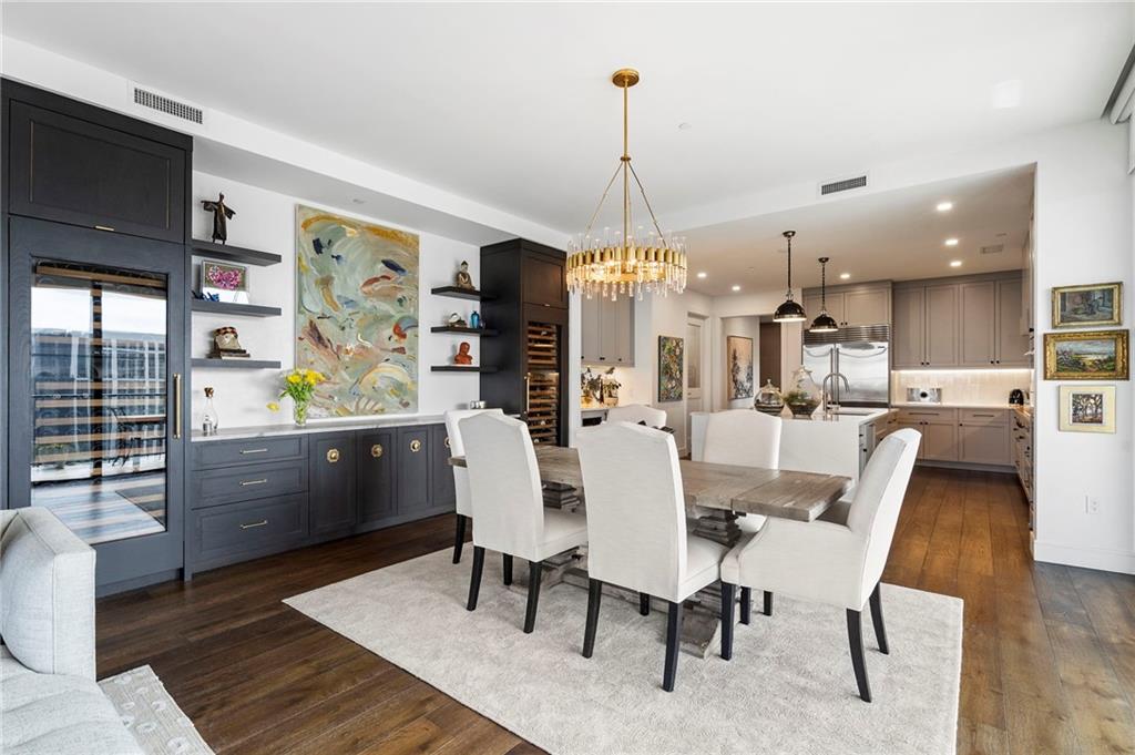 2520 Peachtree Road West, Unit 1203 Atlanta, GA 30305 - Photo 15 of 65 a view of a dining room and livingroom with furniture wooden floor a chandelier