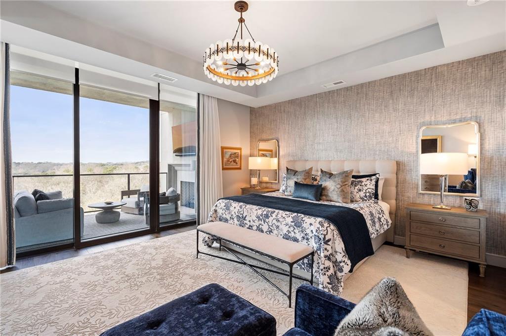 2520 Peachtree Road West, Unit 1203 Atlanta, GA 30305 - Photo 24 of 65 a bedroom with a bed and a large window with the balcony view