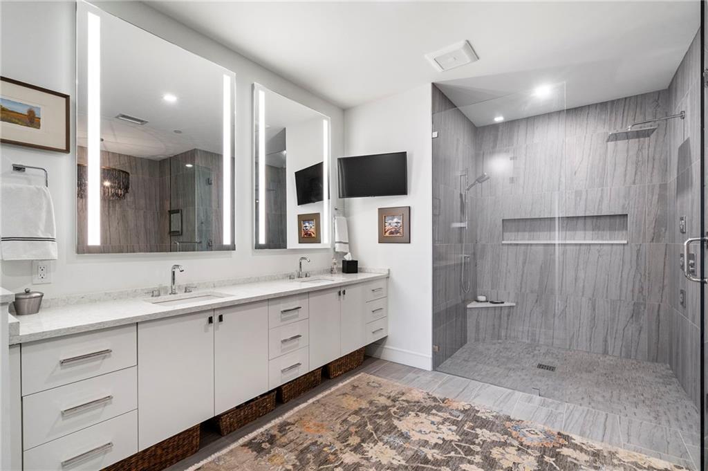 2520 Peachtree Road West, Unit 1203 Atlanta, GA 30305 - Photo 28 of 65 a spacious bathroom with a double vanity sink mirror and double
