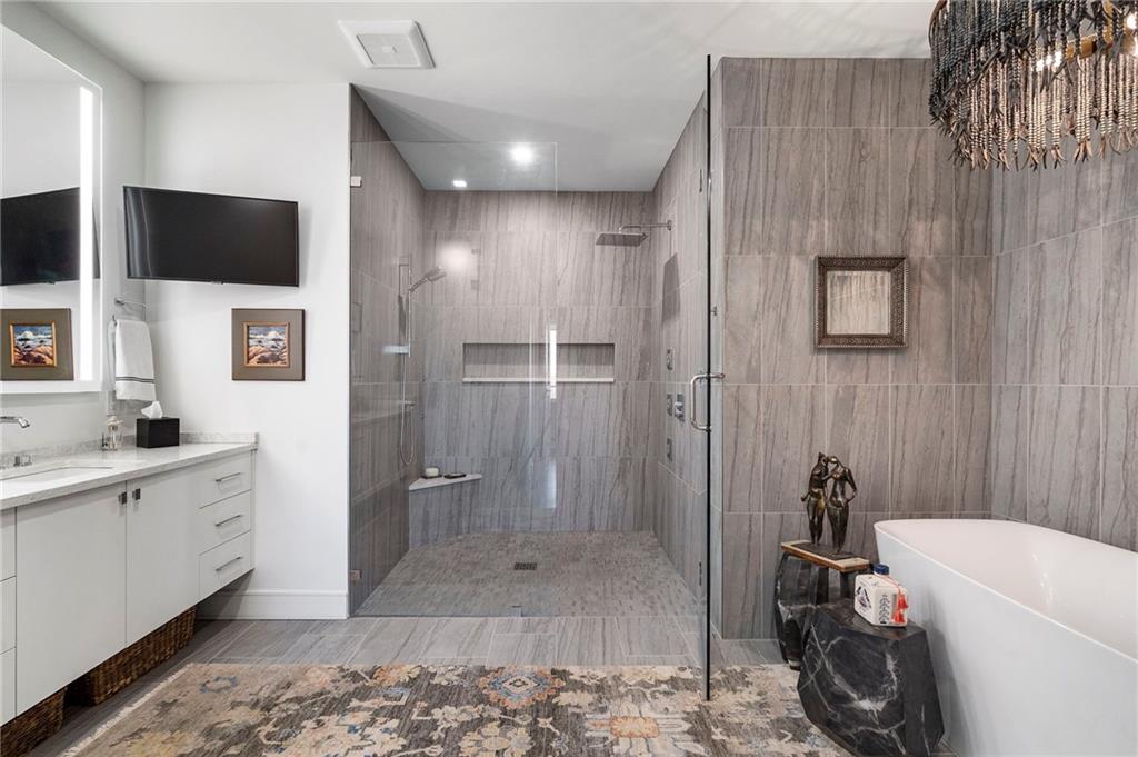 2520 Peachtree Road West, Unit 1203 Atlanta, GA 30305 - Photo 29 of 65 a bathroom with a sink a toilet and shower