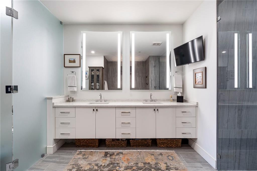 2520 Peachtree Road West, Unit 1203 Atlanta, GA 30305 - Photo 32 of 65 a spacious bathroom with a sink and a mirror