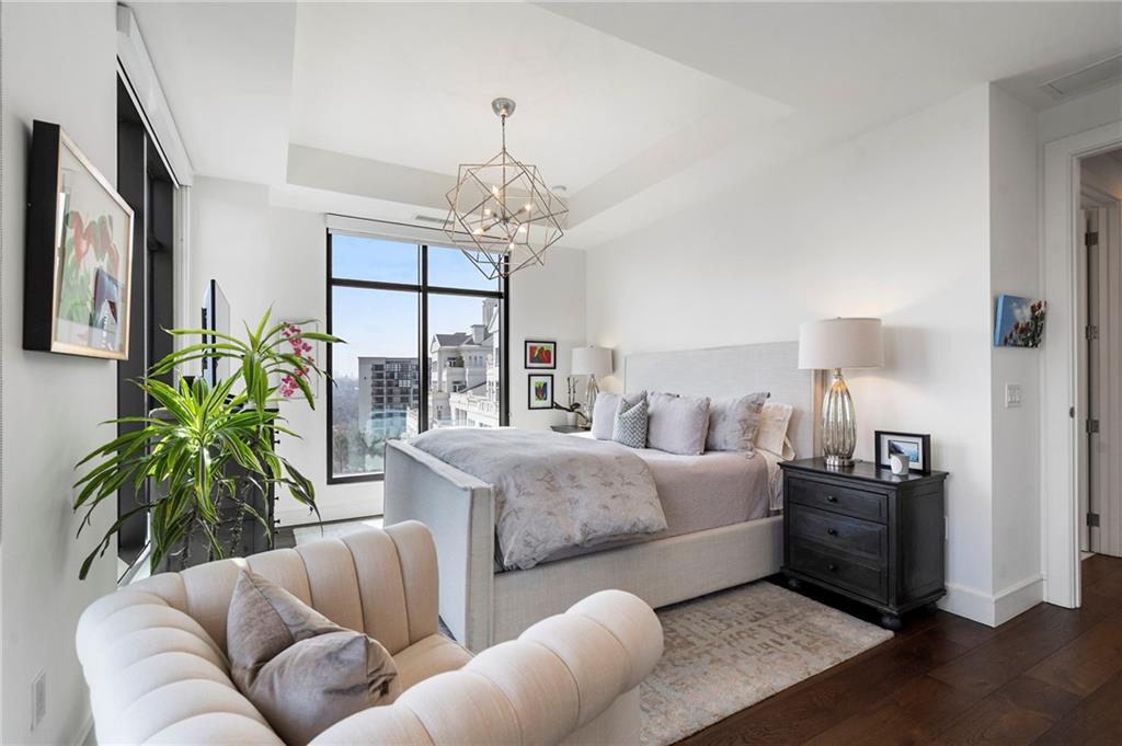 2520 Peachtree Road West, Unit 1203 Atlanta, GA 30305 - Photo 38 of 65 a living room with furniture potted plant and a chandelier