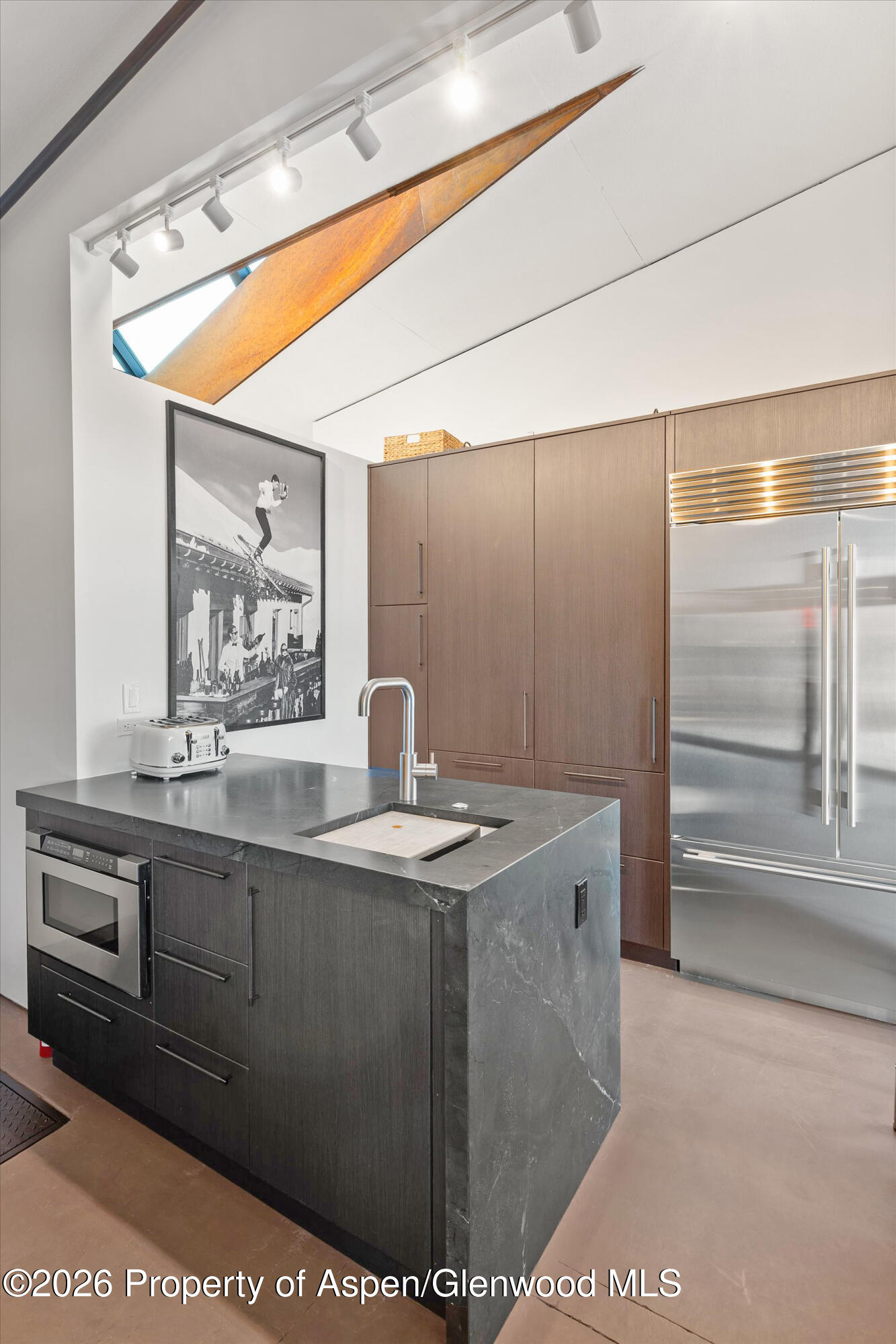 2700 Juniper Hill Road Aspen, CO 81611 - Photo 18 of 39 a kitchen with stainless steel appliances granite countertop a sink and a stove next to a window