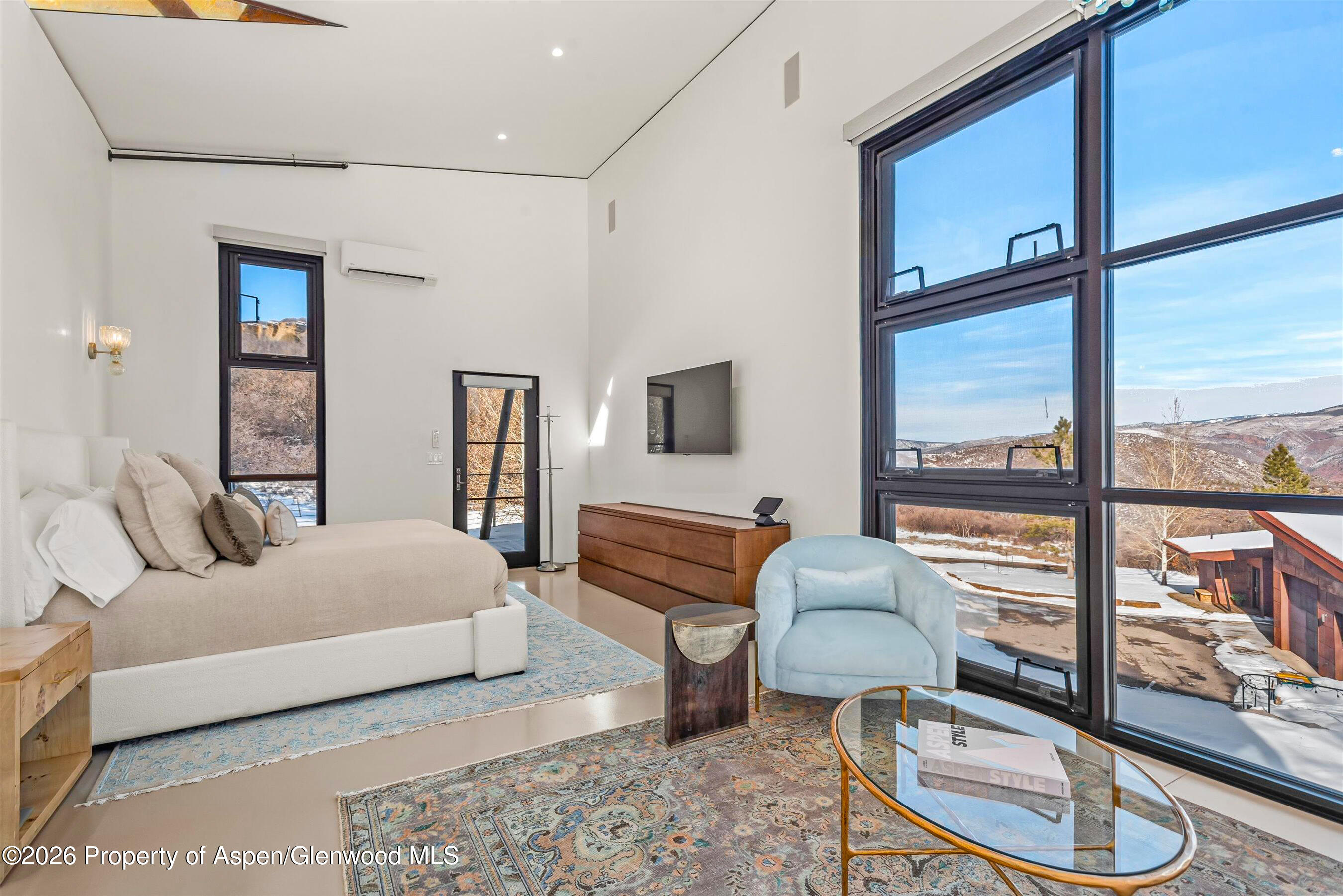 2700 Juniper Hill Road Aspen, CO 81611 - Photo 22 of 39 a bedroom with a bed and large window