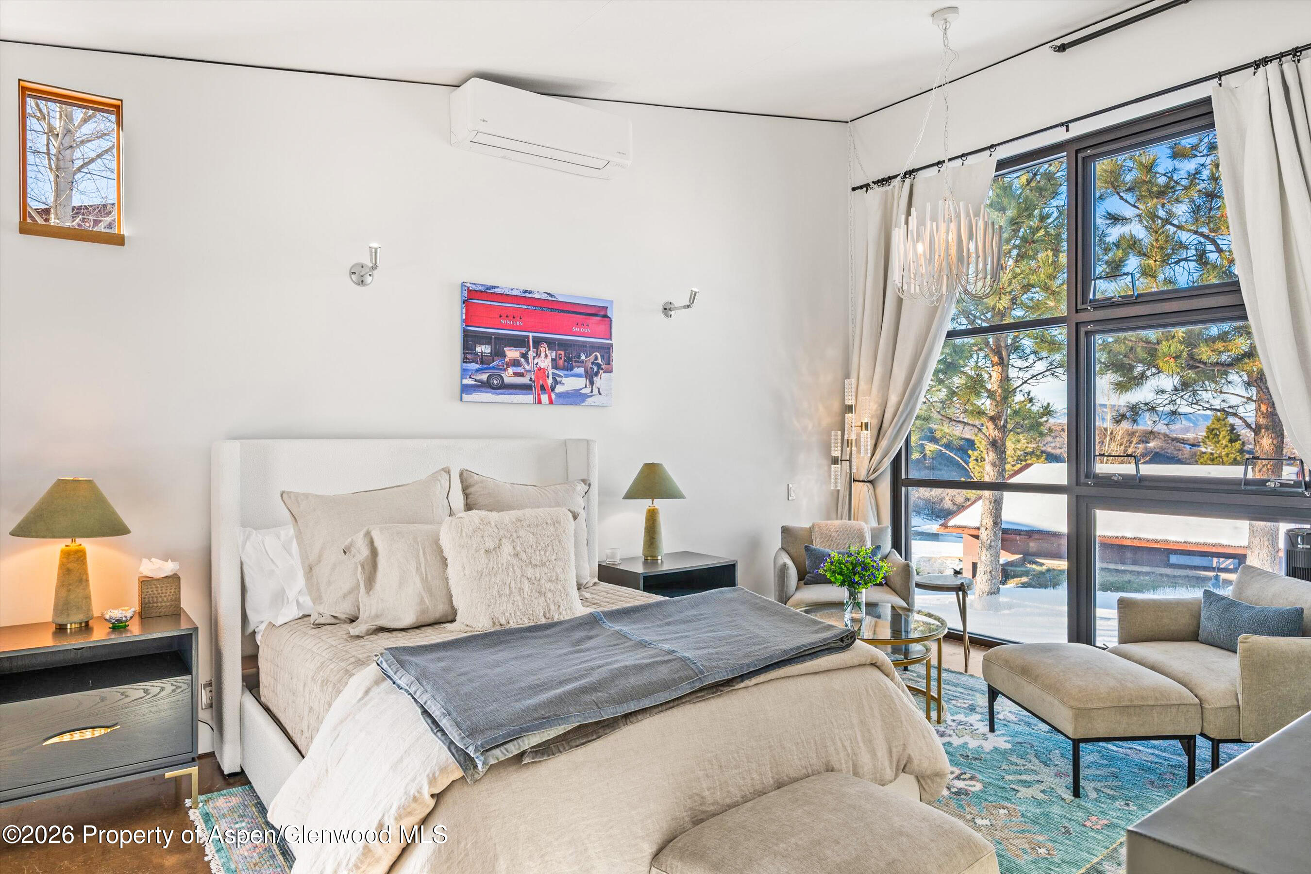 2700 Juniper Hill Road Aspen, CO 81611 - Photo 25 of 39 a bedroom with a bed and a large window with outer view