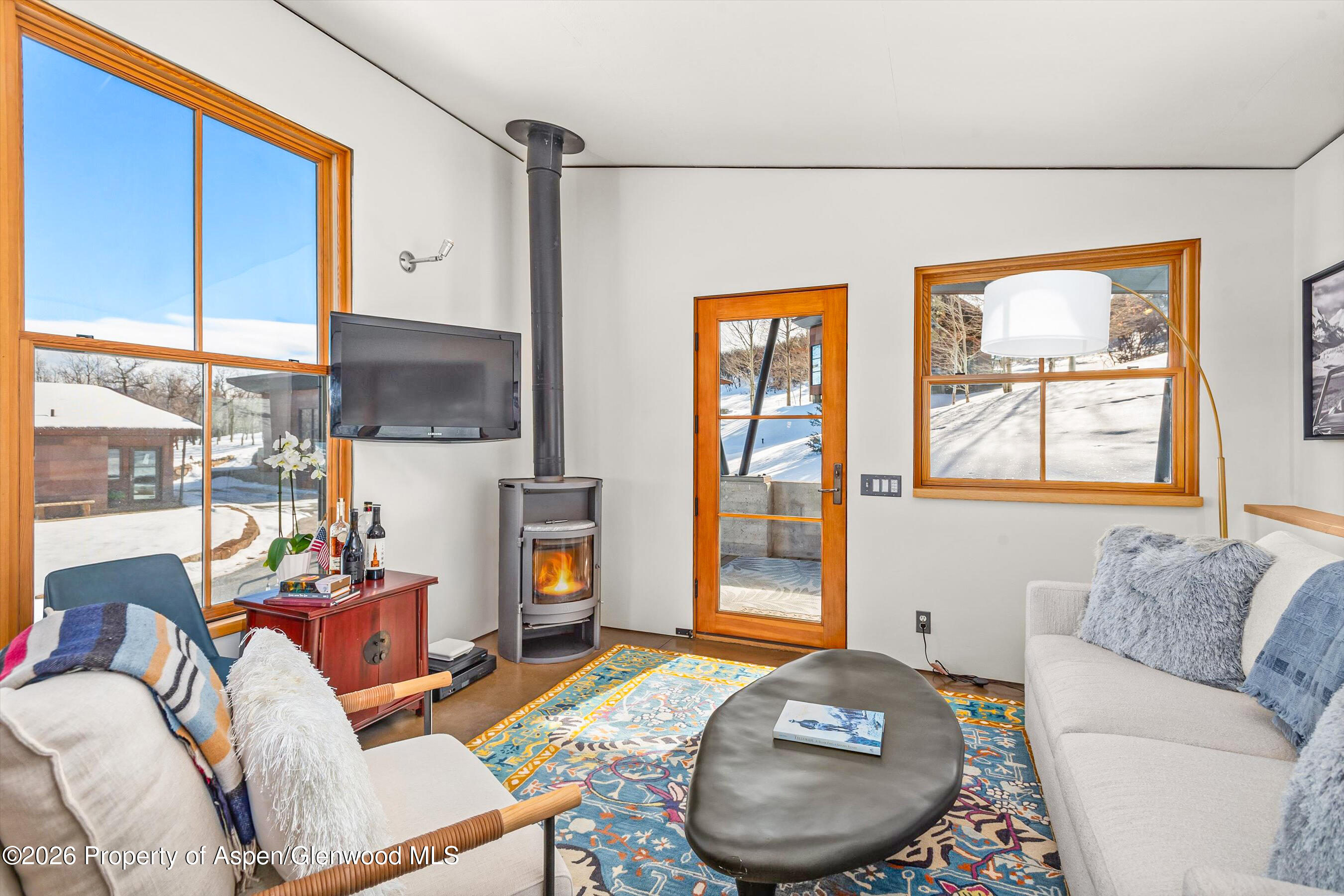 2700 Juniper Hill Road Aspen, CO 81611 - Photo 31 of 39 a living room with furniture and a fireplace